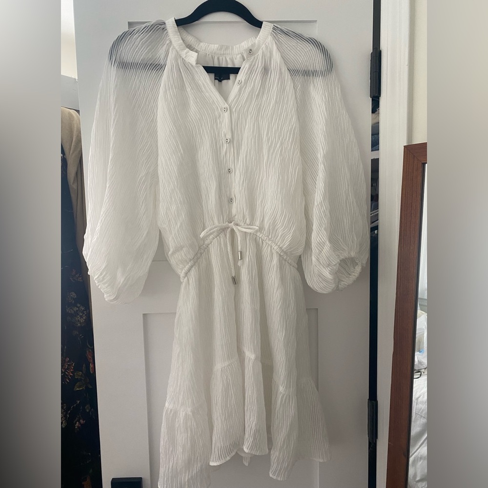 white long sleeve dress. Lined on the body of the dress not the sleeves.